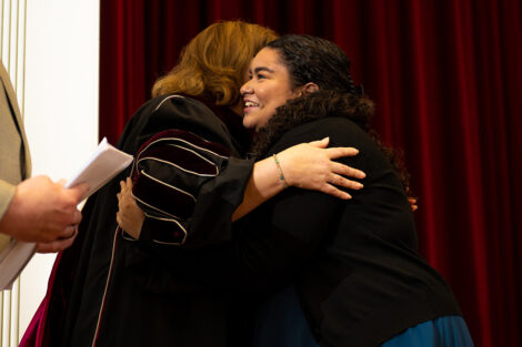 President Nicole Hurd hugs a student.