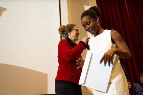 A student accepts their award.