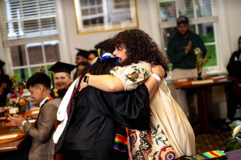 Karina Fuentes embraces a student.