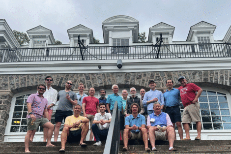 Brothers of Zeta Psi fraternity pose on the steps of the fraternity house at Reunion.