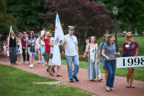 Members of the Class of 1998 walk in the parade.