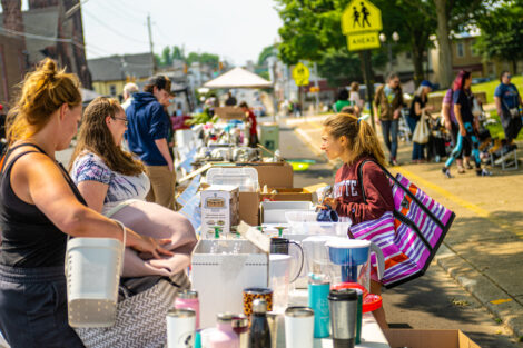 A group of shoppers peruse the gently used items offered at the West Ward Sale.