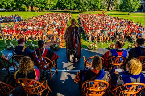 President Nicole Hurd speaks at a podium to the class of 2027.