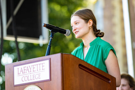 A student speaks at a podium.