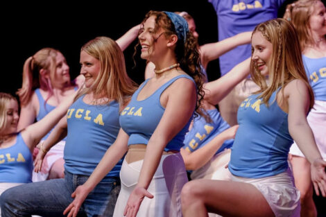 Students dressed as cheerleaders perform during Marquis Players' 2022 production of Legally Blonde.
