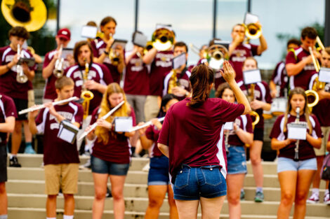 A student conducts the band.