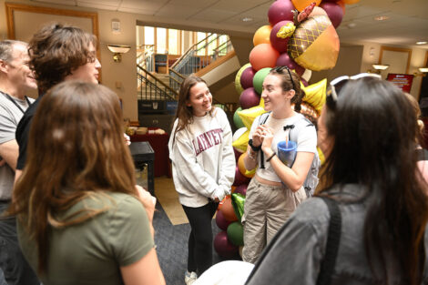 Students congregate at the registration table in Farinon Student Center.