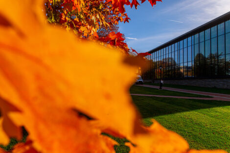 Skillman Library surrounded by orange leaves.