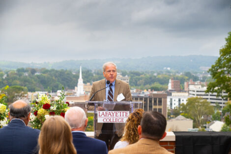 Rep. Bob Freeman speaks at the podium during the Dedication of the Class of 1962 Gateway Plaza.