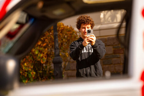 A student takes a picture of the Lehigh car.