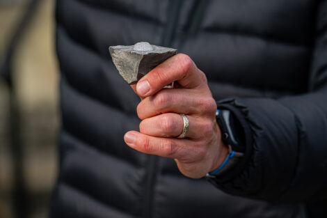 David Sunderlin holds a rock.
