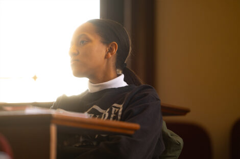 A student listens to a campus class lecture.