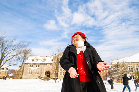 A student prepares to get hit with a snowball.