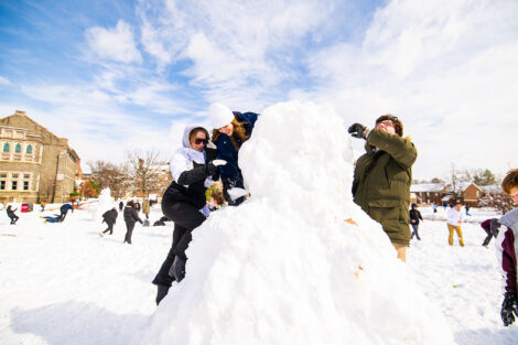 Students build a snowbank.