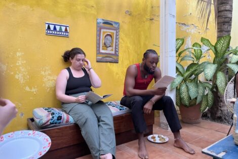 Students sit in a room while abroad in Senegal.