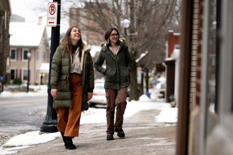 McKenna Graf ’26 and Sam Beedle walk down a street.