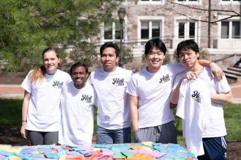 A group photo of Lafayette students wearing 'Holi 2024' shirts.