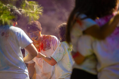Students participate in Holi Fest, the festival of colors.