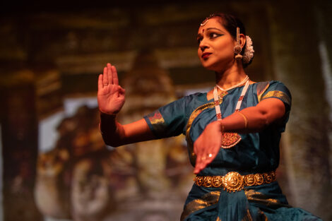 A Lafayette College community member performs a dance on stage during the Grand Finale event.