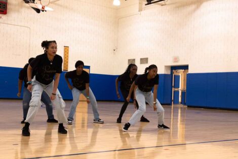 A dance team performs as part of Literacy Day 2024