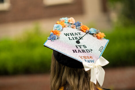A graduation cap reads What, Like it's Hard? 'Cuse law