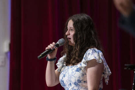 A student speaks on stage