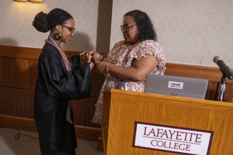 A student is presented with their cords.