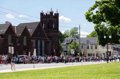 Shoppers line up around the block from Paxinosa Elementary School in anticipation of the West Ward Sale.