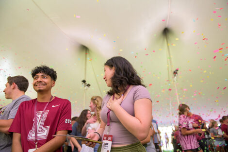 Students watch confetti fall