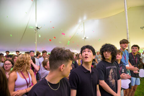 Students watch confetti fall