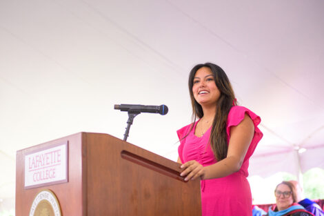 Student government president speaks at a podium