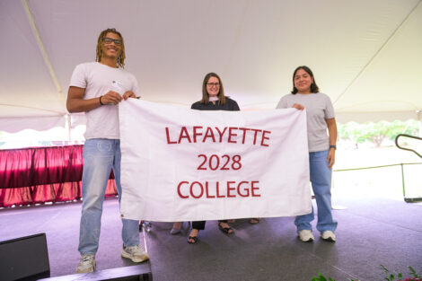 Students hold a Lafayette College 2028 flag