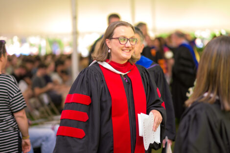 Alex Hendrickson smiles as she walks toward the stage