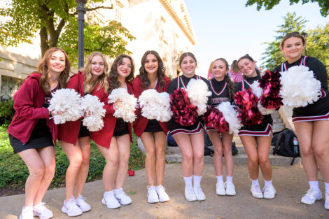 Dance team and cheerleaders smile