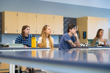 Students listening in a lab.