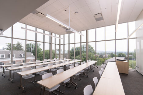 A new classroom with large windows and a sweeping view of campus and Easton.