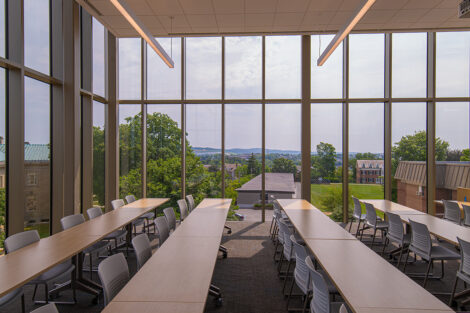 A new classroom with large windows and a sweeping view of campus and Easton.