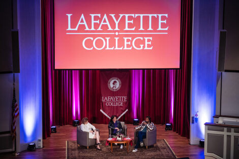 President Nicole Hurd, Jaye Fenderson, and Daveed Diggs speak on stage in Colton Chappel.