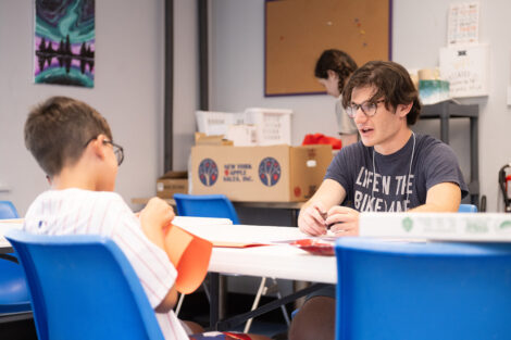 A Lafayette student does crafts with a younger child.