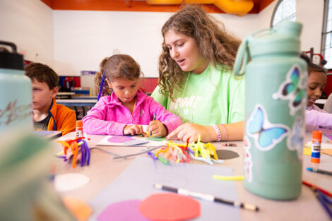 A Lafayette student does crafts with an elementary student