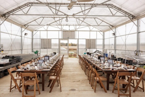 The greenhouse at LaFarm is set up for a luncheon.