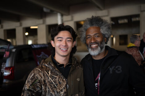 Two men are smiling at the camera in Markle Parking Deck.