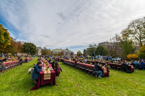 Wide view of the Quad set up with long tables for Fall Fest.