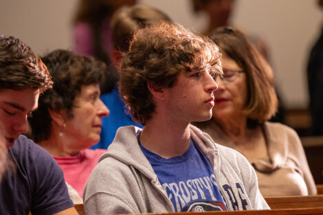 A student watches a speaker at Colton.