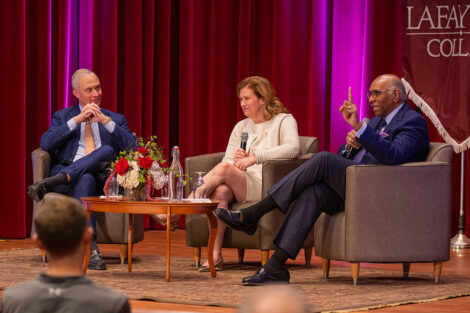 President Hurd, Harold Ford Jr., and Michael Steele sit on the stage of Colton Chapel.