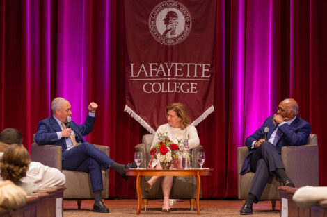 President Hurd, Harold Ford Jr., and Michael Steele sit on the stage of Colton Chapel.