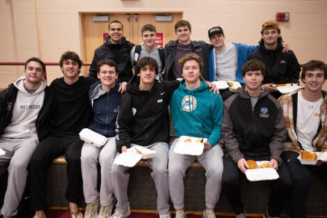 Students smile with food.