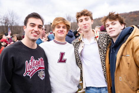 Students smile, wearing leopard, maroon, and white.