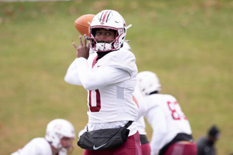 A football player throws the ball.