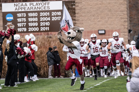 The Leopard leads the Lafayette football players into the stadium.